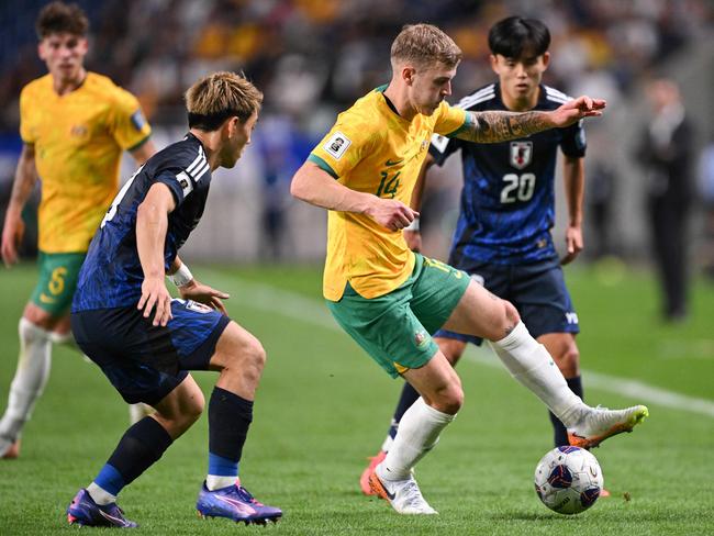 Australia's Riley McGree controls the ball during the FIFA World Cup 2026 Asian zone qualifiers football between Japan and Australia at Saitama Stadium in Saitama on October 15, 2024. (Photo by Philip FONG / AFP)