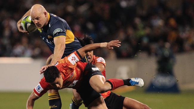 Stephen Moore of the Brumbies is tackled at GIO Stadium.