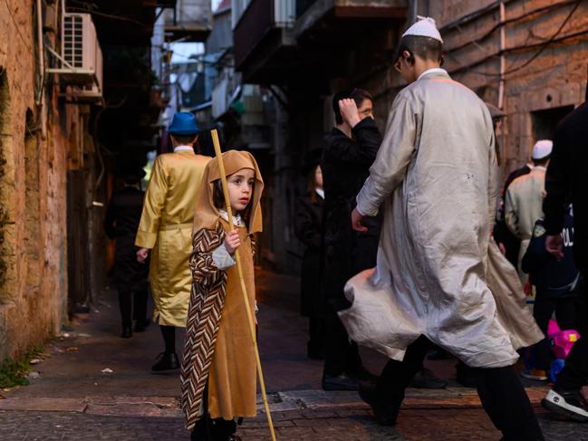 JERUSALEM - MARCH 25: An Ultra-Orthodox Jewish boy wearing a costume celebrates Purim in the Ultra-Orthodox neighborhood of Mea Shearim, on March 25, 2024 in Jerusalem. The Jewish holiday of Purim commemorates the saving of the Jewish people in ancient Persia. In Jerusalem, the holiday is celebrated one day later than the rest of the country and world and is referred to as Shushan Purim. (Photo by Alexi J. Rosenfeld/Getty Images) ***BESTPIX***