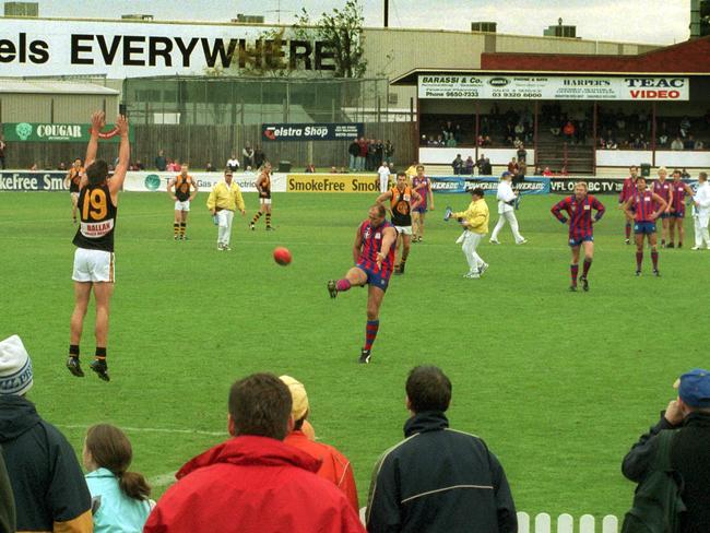 The great Tony Lockett kicks a goal for Port Melbourne at North Port in 2002.