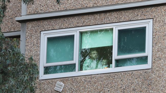 A resident of a housing tower on Racecourse Rd in Flemington, locked down by the Victorian Government. Picture: David Crosling