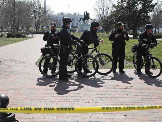 US Secret Service officers stand in the cordoned off Lafayette Park after a security incident near the fence of the White House. Picture: AP Photo/Alex Brandon