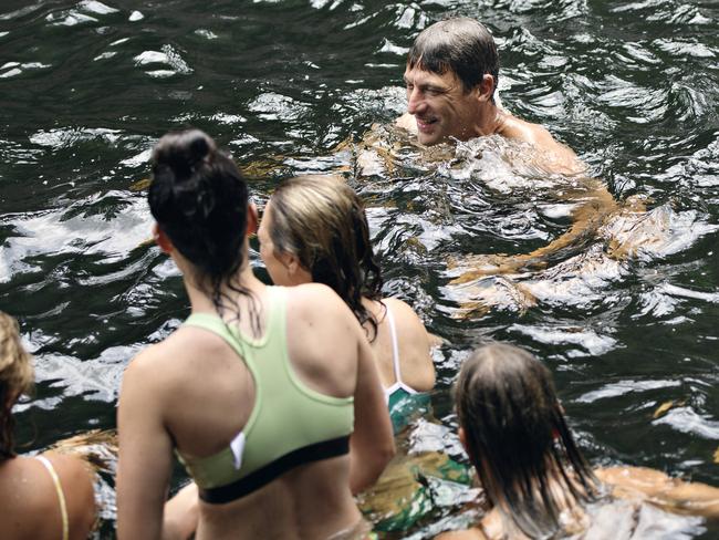 Adelaide Crows coach Matthew Clarke swimming with the team at Florence Falls. The Adelaide Crows AFLW team spent the day at Litchfield National Park, Northern Territory, for their post-match recovery after playing Fremantle in a trial match at TIO Stadium.