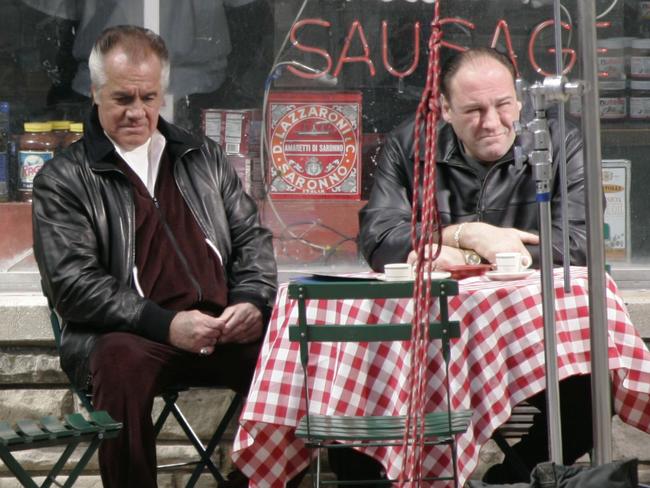 Actors Tony Sirico, left, who plays Paulie Walnuts and James Gandolfini, right, as Tony Soprano, appear in a scene from the drama, "The Sopranos," outside the fictional Satriale's pork store in Kearny, N.J., Wednesday, March   21, 2007. Cast and crew are filming the last episodes of the popular HBO series about a New Jersey mafia family. (AP Photo/Mike Derer)