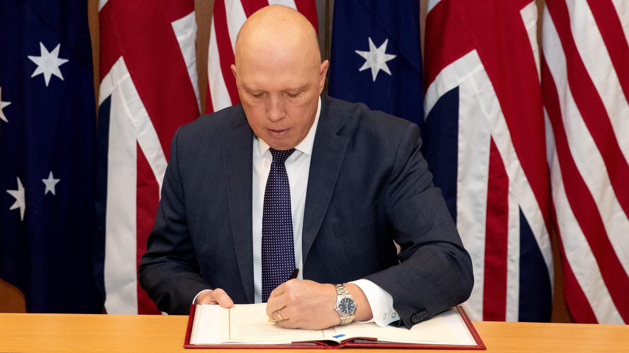 Australia's Minister for Defence Peter Dutton signing the Exchange of Naval Nuclear Propulsion Information Agreement in Canberra. Picture: Kym Smith / Australian Defence Force / AFP