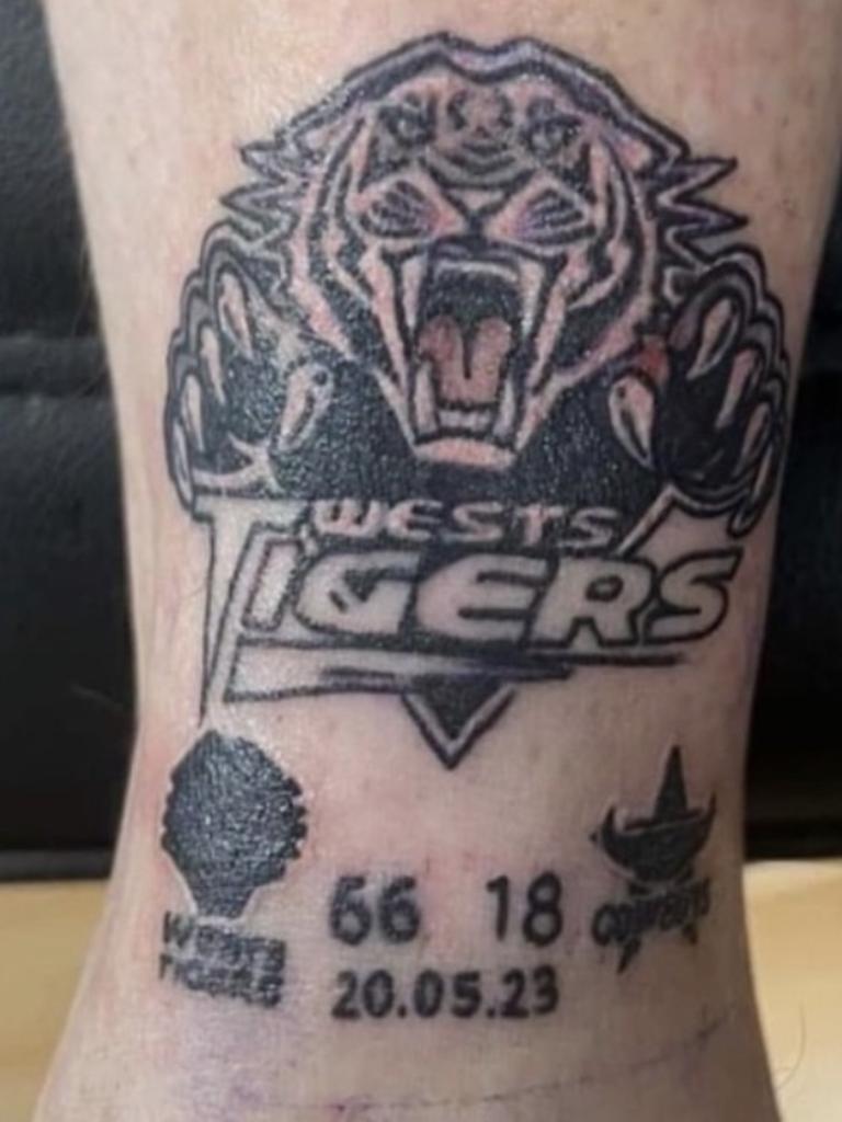 A mad Wests Tigers fan sporting his tattoo after his NRL club's win last week.