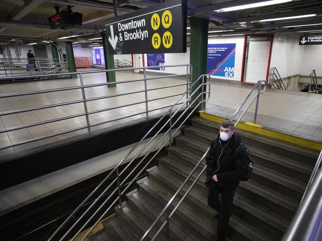 A commuter walks through a normally busy Union Square subway station in New York. Picture: AP