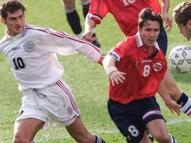 (FILES) Georgian players Mikhail Kavelashvili (L) fights for the ball at Ullevaal Stadium in Oslo 20 May 1999 during Euro 2000 group 2 qualifier. Georgia's ruling party on November 27, 2024 nominated far-right politician, former footballer and staunch loyalist Mikheil Kavelashvili as a candidate for president in the 14 December elections, aiming to further consolidate its grip on power. (Photo by TOR RICHARDSEN / SCANPIX / AFP)