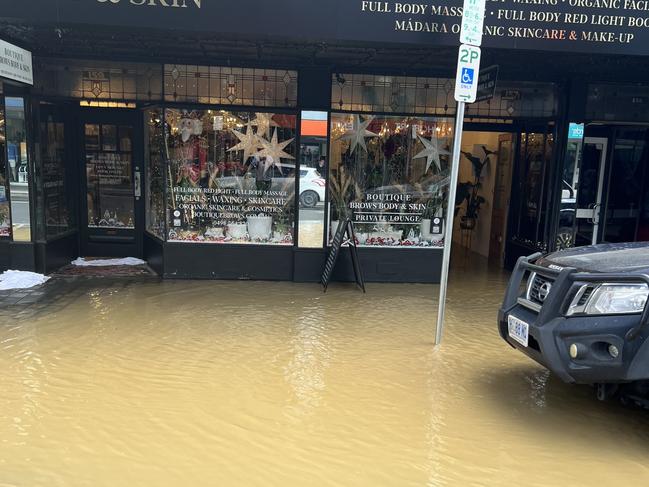 Water from the burst water main flooded Liverpool Street between Harrington and Murray Street. Picture: supplied.