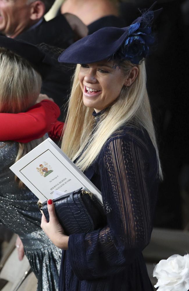 Chelsy Davy smiles as she arrives for the wedding of Princess Eugenie of York and Jack Brooksbank in St George’s Chapel, Windsor Castle, near London, England, Friday Oct. 12, 2018. (Yui Mok, Pool via AP)