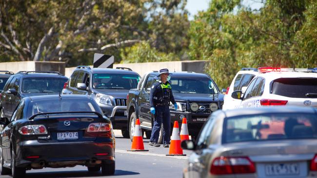 Victoria Police man a checkpoint on the Echuca-Moama bridge, the border between Victoria and New South Wales. Picture: Mark Stewart