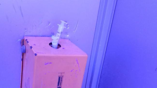 An overflowing sharps box in a Lismore CBD public toilet. Picture: Heather Rudd