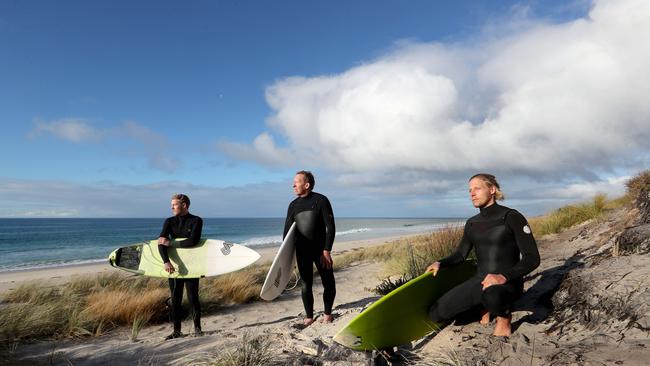 Guy Barnes, 53, with sons Dermot, 26, and Liam, 22, at Martha Lavinia beach on King Island’s northeast coast, are against an aquaculture development. Picture: David Geraghty