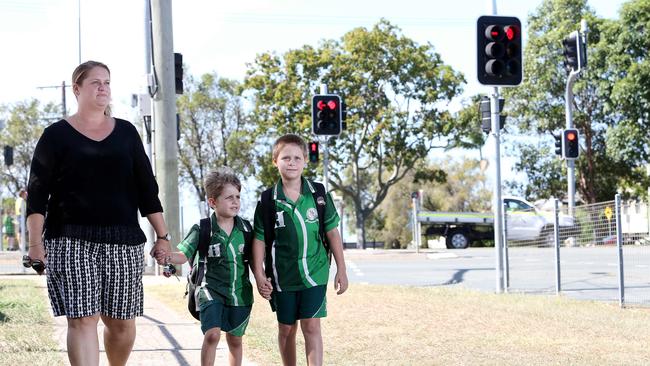 Richelle MacArthur with Oliver and Lincoln of Kippa-Ring from the Hercules Road State School. Pic: Josh Woning.