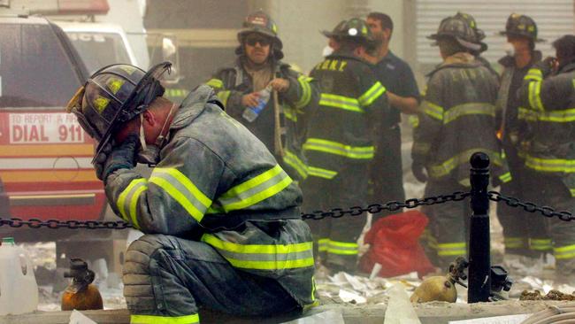 A firefighter breaks down after the World Trade Center buildings collapsed September 11, 2001 after two hijacked aeroplanes slammed into the twin towers in a terrorist attack. Picture: Getty