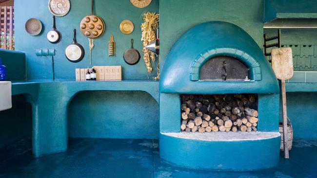 A peacock-blue outdoor kitchen at Dr Kavvadia for alfresco dining. Picture: Markos Kyprianos.