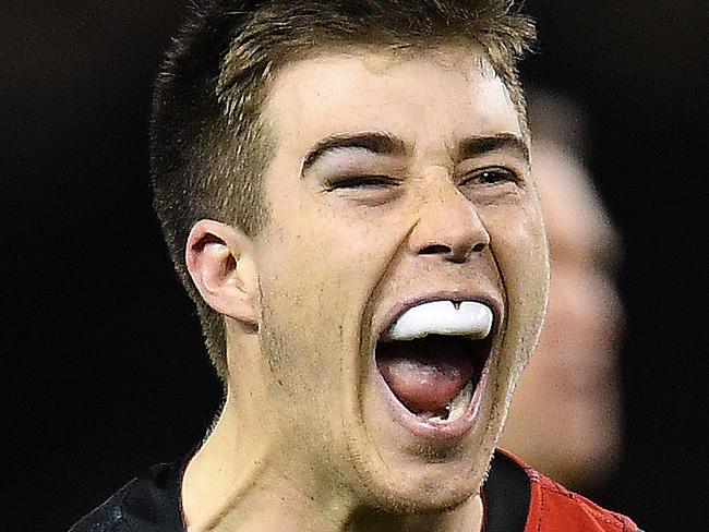 Zach Merrett  of the Bombers reacts after kicking a goal during the Round 19 AFL match between the Essendon Bombers and the Sydney Swans at Etihad Stadium in Melbourne, Friday, July 27, 2018. (AAP Image/Julian Smith) NO ARCHIVING, EDITORIAL USE ONLY