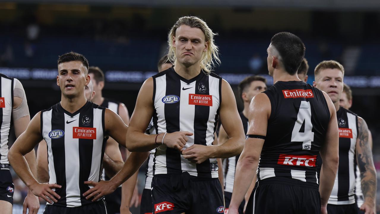 Darcy Moore leads his team off the MCG after tonights loss to Sydney. Pic: Michael Klein