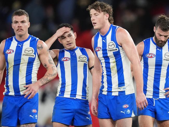 MELBOURNE, AUSTRALIA - JUNE 16: Cameron Zurhaar, Zac Fisher, Nick Larkey and Luke McDonald of the Kangaroos look dejected after the round 14 AFL match between North Melbourne Kangaroos and Collingwood Magpies at Marvel Stadium, on June 16, 2024, in Melbourne, Australia. (Photo by Daniel Pockett/Getty Images)