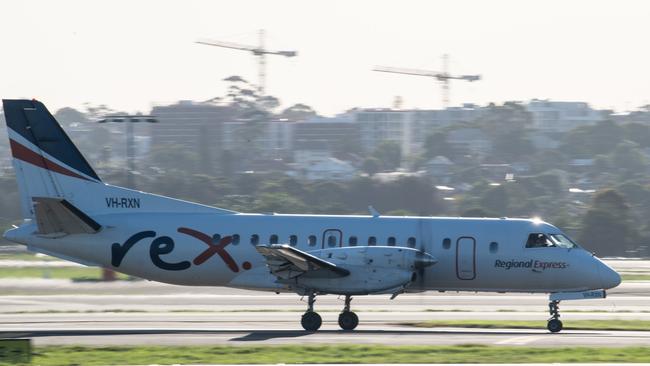 A Rex (Regional Express) aircraft on the tarmac at Sydney Airport, Friday, March 20, 2020. (AAP Image/James Gourley) NO ARCHIVING