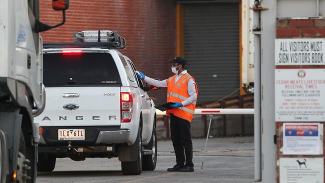 Cedar Meats employees being tested before starting work on Monday. Picture: David Crosling