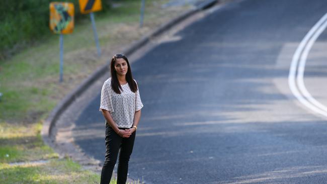 Belinda Miljkovic stands on Powell St Charlestown, the spot where her friend was taken in 1994. Picture: Sue Graham