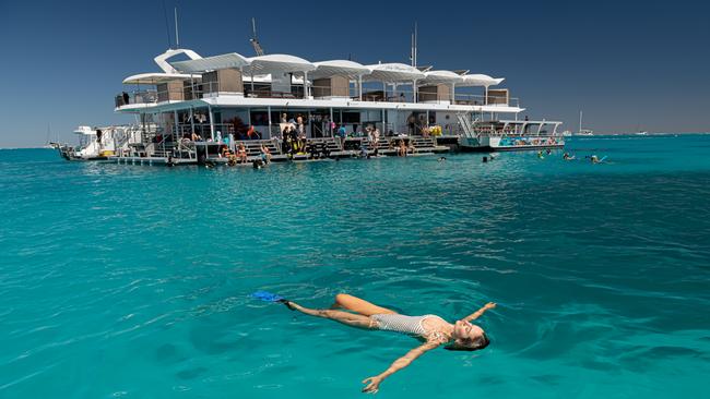 Kate Bray from Bundaberg enjoying the Lady Musgrave HQ pontoon, where you can sleep on the reef. Picture: Paul Beutel