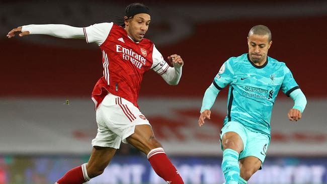 Arsenal's Gabonese striker Pierre-Emerick Aubameyang (L) vies for the ball against Liverpool's Spanish midfielder Thiago Alcantara (R) during the English Premier League football match between Arsenal and Liverpool at the Emirates Stadium in London on April 3, 2021. (Photo by Julian Finney / POOL / AFP) / RESTRICTED TO EDITORIAL USE. No use with unauthorized audio, video, data, fixture lists, club/league logos or 'live' services. Online in-match use limited to 120 images. An additional 40 images may be used in extra time. No video emulation. Social media in-match use limited to 120 images. An additional 40 images may be used in extra time. No use in betting publications, games or single club/league/player publications. /