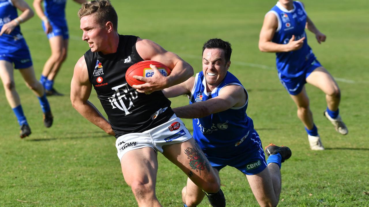 St Peter's Old Collegians v Port District in Division one Adelaide Football League match at St Peter's College, Hackney, Adelaide on Saturday the 27th of July 2019. PD - Sean Davidson v STP - Jack Johnson(AAP Image/Keryn Stevens)