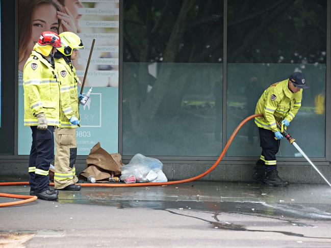 Firefighters cleaning up blood off Pirrama Rd on September 22. Picture: Adam Yip