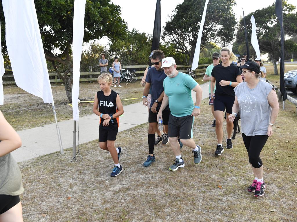 Competitors take off from the Whiting Beach start of the Yamba Triathlon Fun Run on Saturday morning.