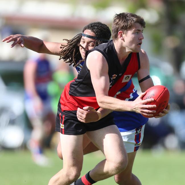 Waaia’s Ben Armstrong takes off with the ball.