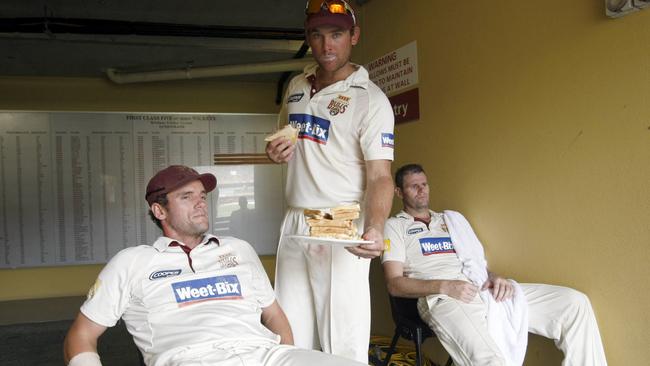 Captain Chris Simpson gets offered a sandwich by Ryan Broad with Chris Swan.