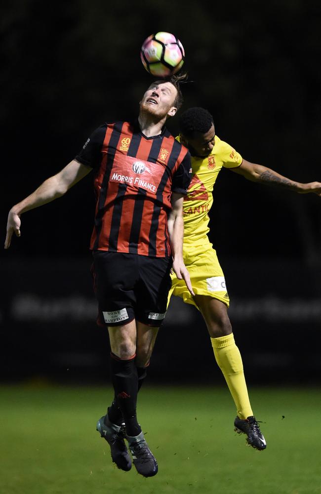 Preston striker Jacob Fulluck wins a header against league leader Geelong. Picture: David Smith.