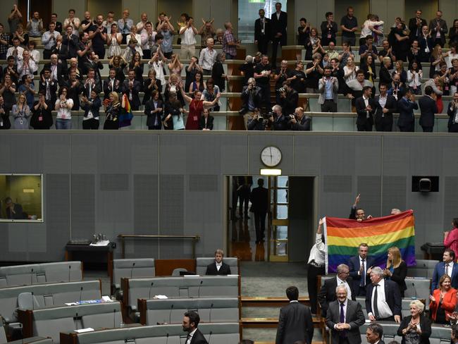 Members of Parliament celebrate at Parliament House. Picture: Getty