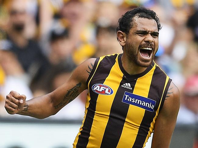 MELBOURNE, AUSTRALIA - APRIL 08:  Cyril Rioli of the Hawks celebrates kicking a goal during the round three AFL match between the Richmond Tigers and the Hawthorn Hawks at Melbourne Cricket Ground on April 8, 2018 in Melbourne, Australia.  (Photo by Brett Hemmings/Getty Images/AFL Media)