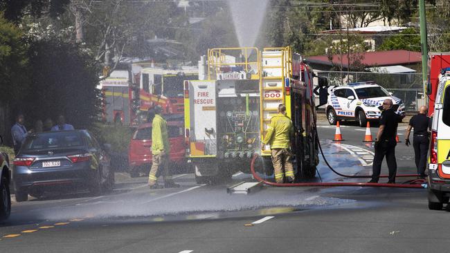 Firefighters and police on the scene of the Woodridge house fire. Picture: Attila Csaszar/NCA NewsWire