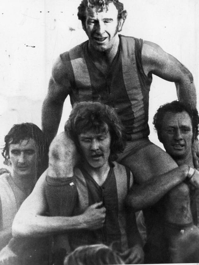 West Torrens footballer Fred Bills is chaired off the ground after the controversial 1975 match.