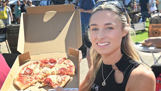 Charlotte Newton has pizza for lunch at the Royal Adelaide Show. Picture: Keryn Stevens