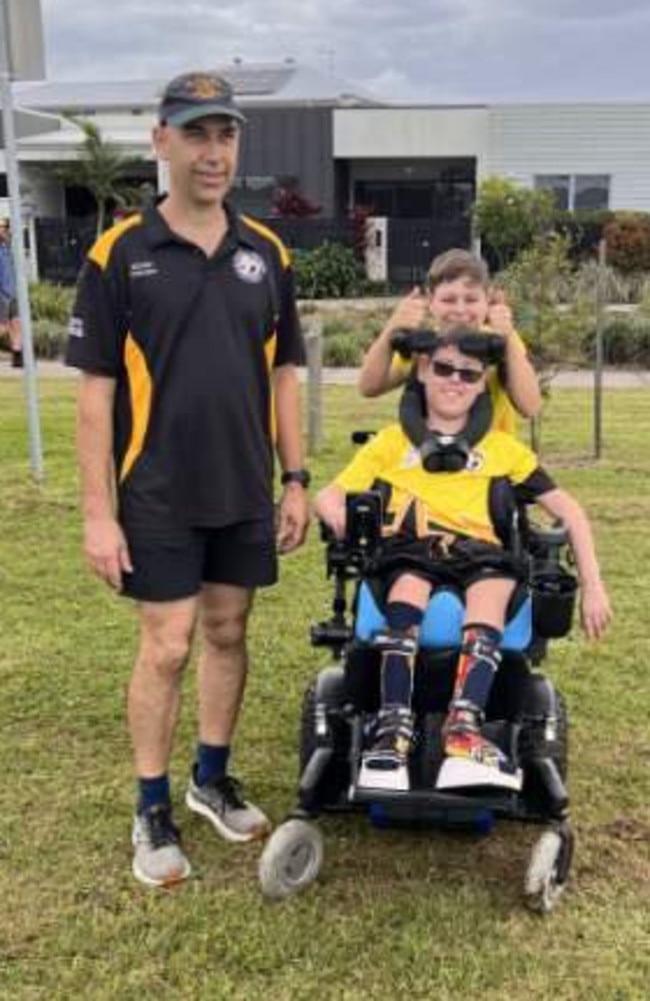 Trevor Pickens and two of his children who both participate in the all abilities soccer program. Photo: contributed