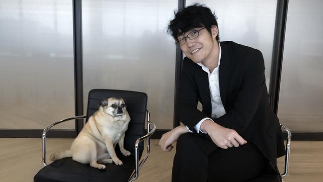 Oki Sato, founder of Japanese design studio Nendo, with his dog Kinako Picture: Megan Miller