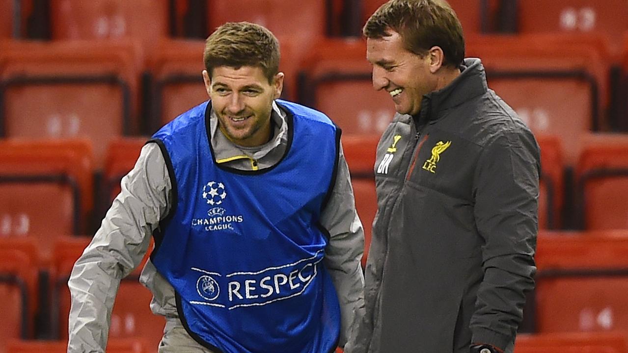 LIVERPOOL, ENGLAND - DECEMBER 08: Brendan Rodgers, manager of Liverpool smiles with Steven Gerrard during a training session ahead of the UEFA Champions League match against FC Basel 1893 at Anfield on December 8, 2014 in Liverpool, England. (Photo by Laurence Griffiths/Getty Images)