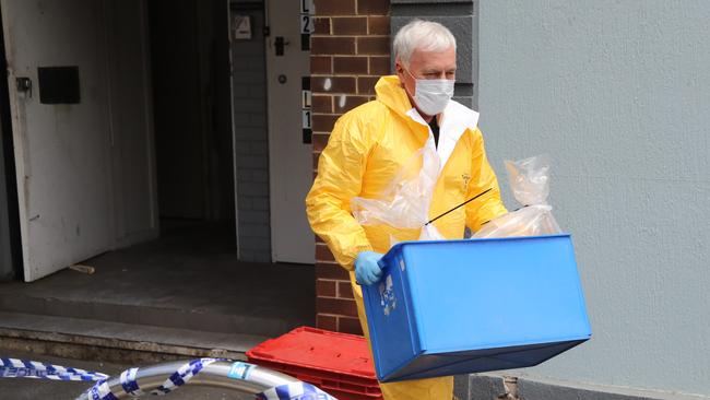 Plastic bags and glassware were removed from the building. Picture: Alex Coppel.