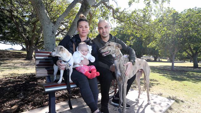 Kylie and Ventura Caso, baby Angelina and dogs Basil (L) and Jove will not be frightened away by the attacks against dogs. Picture: AAP/Richard Gosling