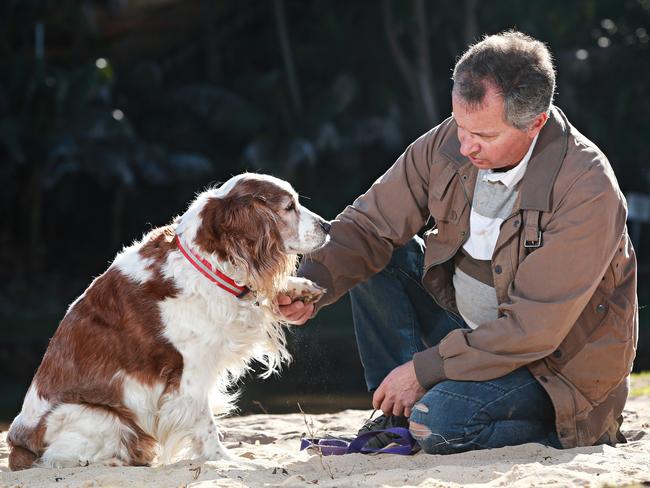 Mitch Geddes with his dog Cooper at Queenscliif Lagoon. There is no suggestion of any bad behaviour by him or his dog. Picture: Adam Yip.