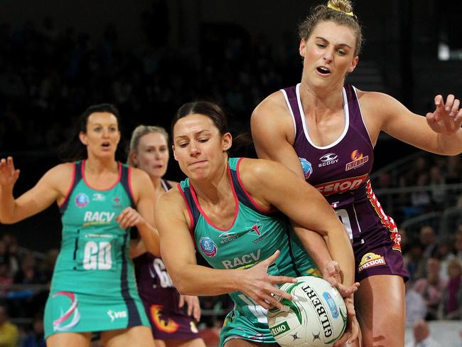 Vixen Madi Robinson (centre) fights for possession with Gabi Simpson of the Firebirds (right) in the ANZ Championship grand final. Picture: Getty Images