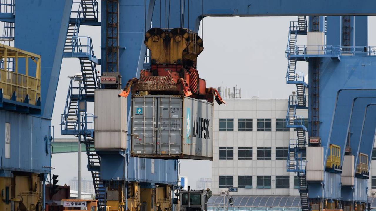 A gantry crane loading a Maersk branded container. The Gladstone Ports Corporation has $400,000 from the government to progress installation of a crane to move freight.