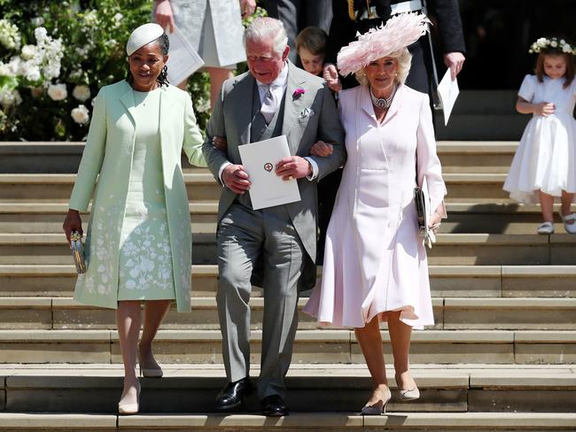 Doria Ragland, Prince Charles, Prince of Wales and Camilla, the Duchess of Cambridge leave after the wedding ceremony. AFP/Jane Barlow