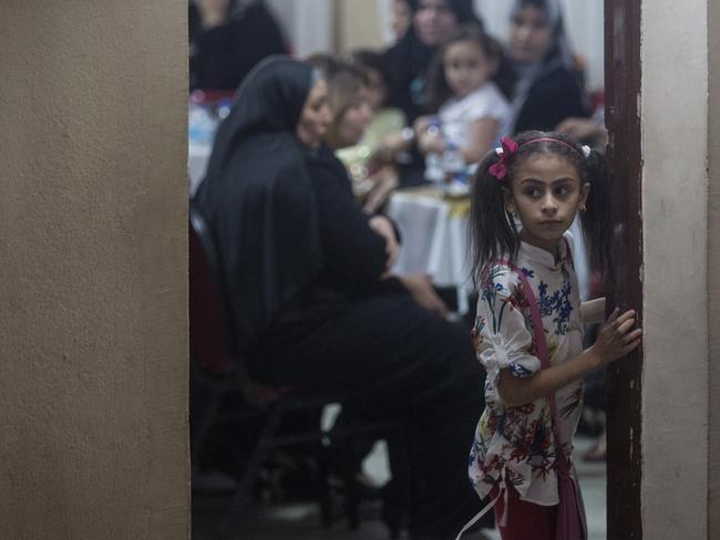 Friends and family attend a memorial service in Cairo. Picture: Chris McGrath