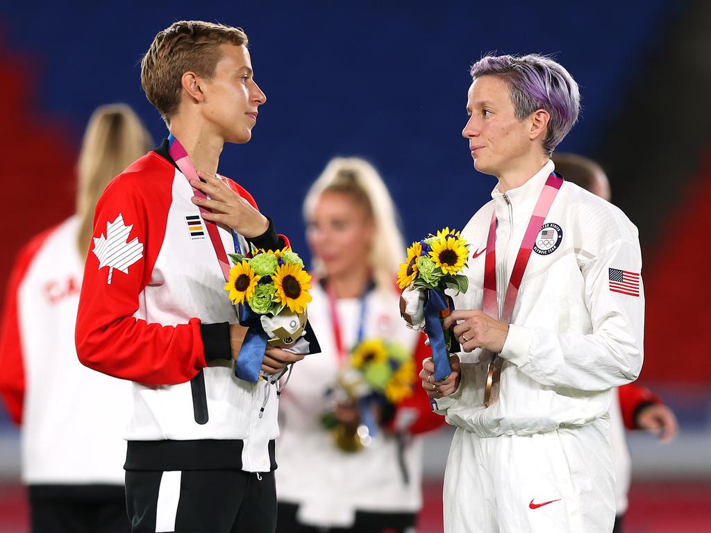 Gold medallist Quinn interacts with bronze medallist Megan Rapinoe of the United States. (Photo by Naomi Baker/Getty Images)